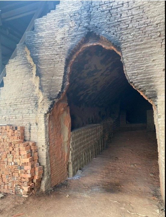 Ancient vaulted brick kiln oven workshop along the river