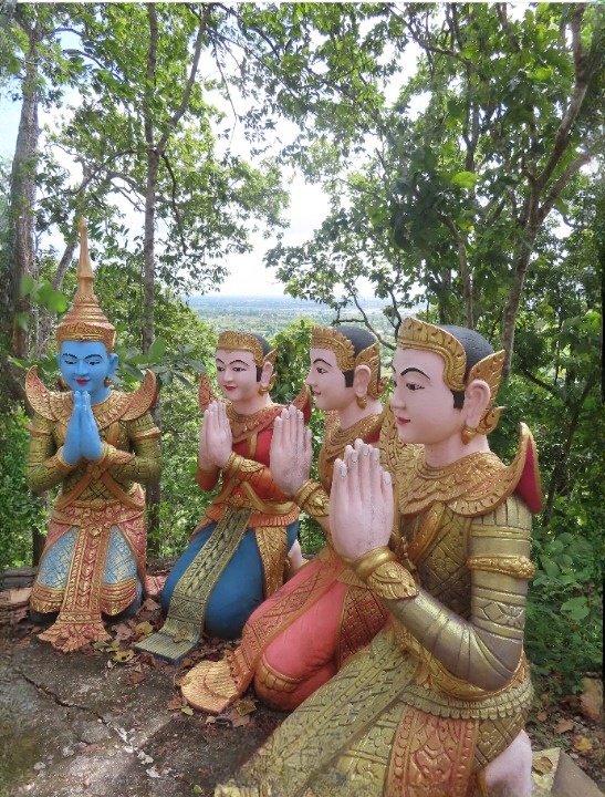 Sacred praying statues on top of Phnom Sambok hill